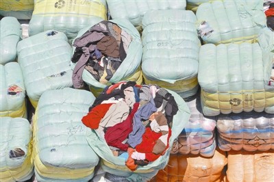 揭秘走私洋垃圾暴利链：旧服装利润至少10倍